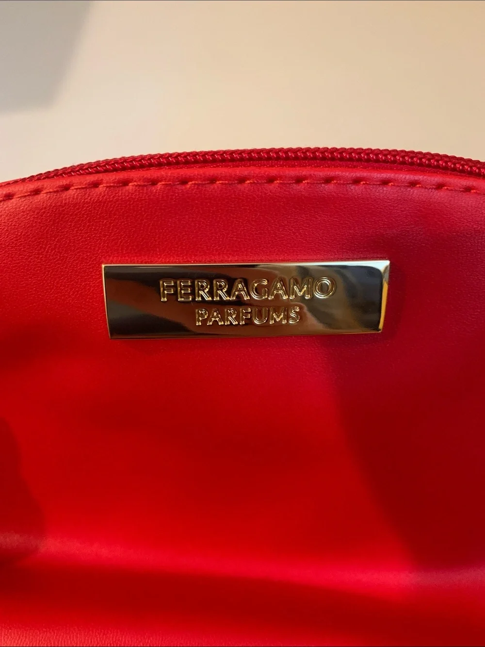 NWOT Salvatore Ferragamo Parfums Red Cosmetic Case with Gold Logo Plaque